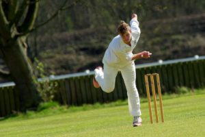 woman playing cricket